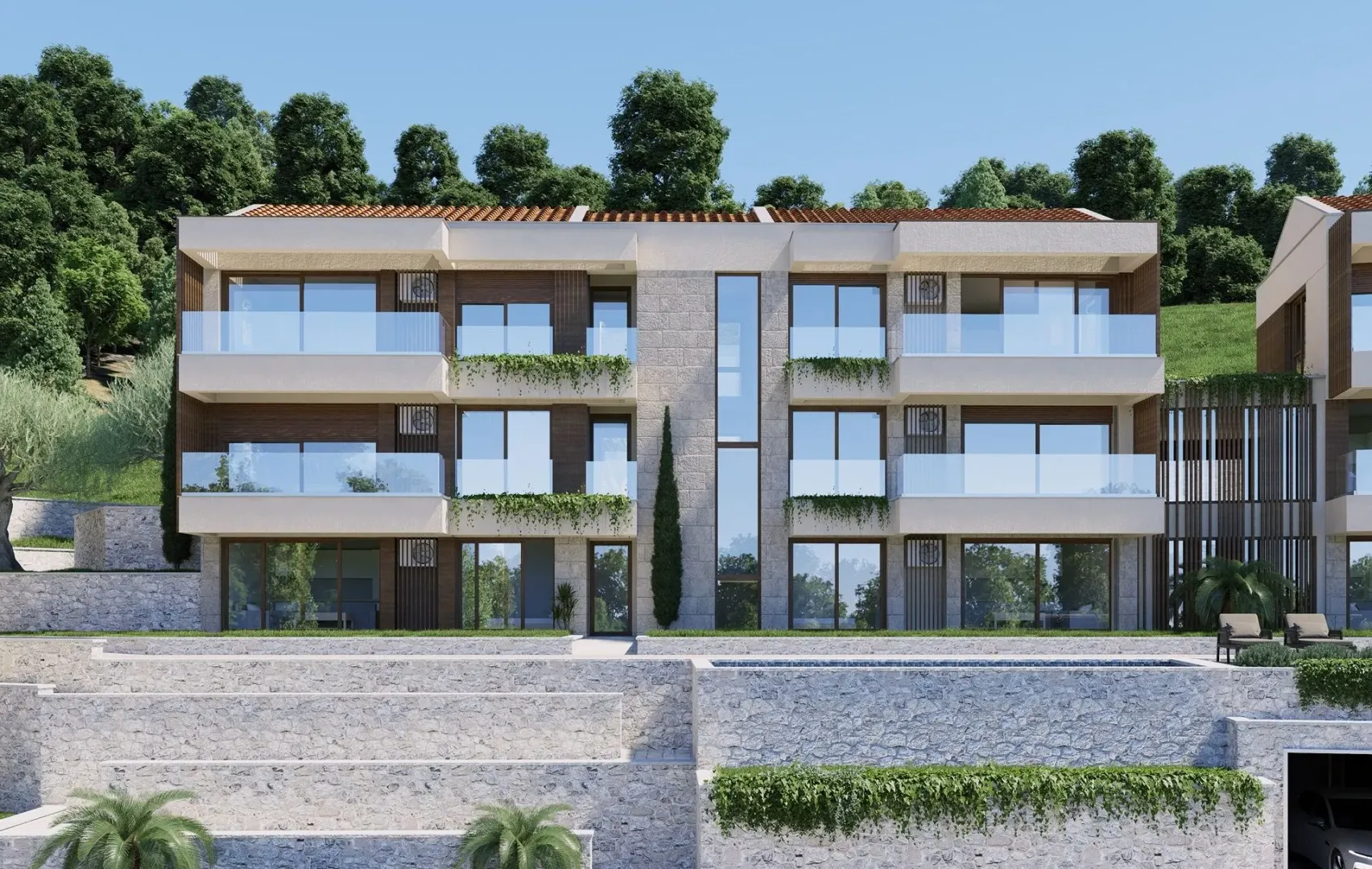 Spoljašnji izgled moderne stambene zgrade sa terasama i uređenim dvorištem.