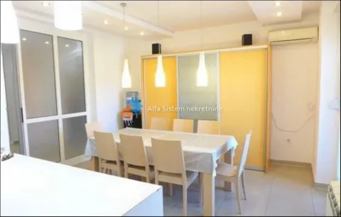 Dining area with a table, chairs, and a large built-in wardrobe. - image 23