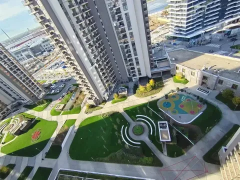 High-angle view of the building's courtyard and surrounding structures. - image 17