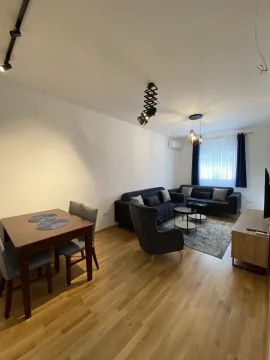 Bright living room with a dining table and modern furniture. - image 6