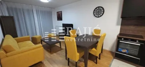 Living room with dining area and kitchen. - image 2