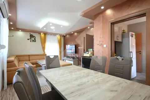 Living room with a dining area and seating furniture. - image 5