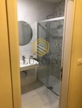 Modernly equipped bathroom with a shower cabin. - image 6