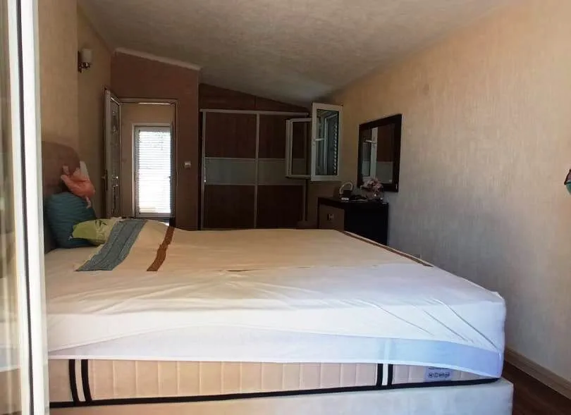 Bedroom with a double bed and a wardrobe.
