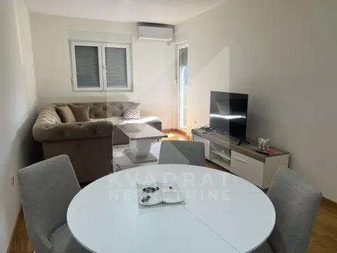 Living room with sofa, TV and dining table. - image 2
