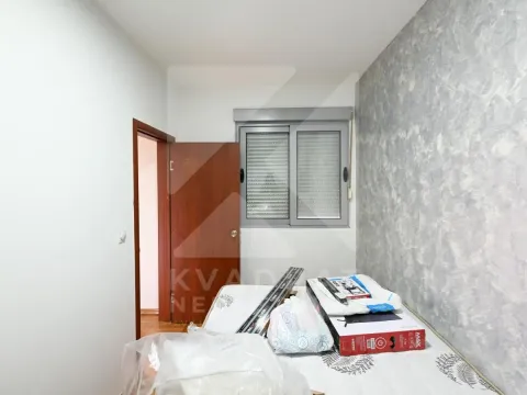 Unfurnished room with a bed and an open door. - image 6