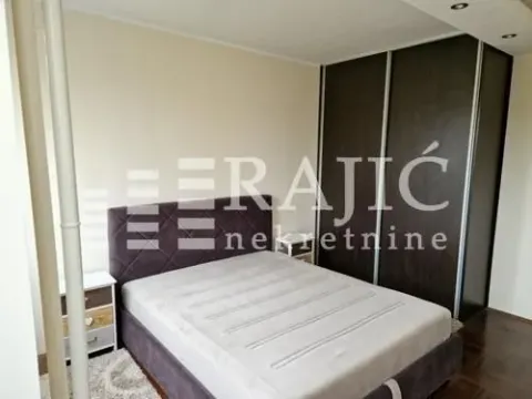 Furnished bedroom with a double bed and a fitted wardrobe. - image 9
