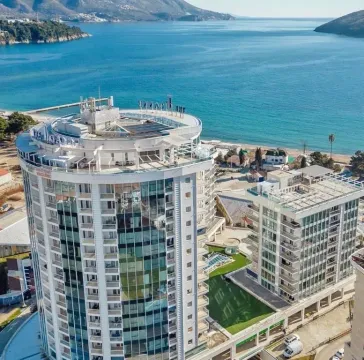 Aerial view of modern residential buildings by the sea. - image 8