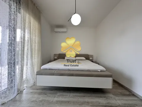 Modern bedroom with a double bed and wall-mounted air conditioner. - image 17