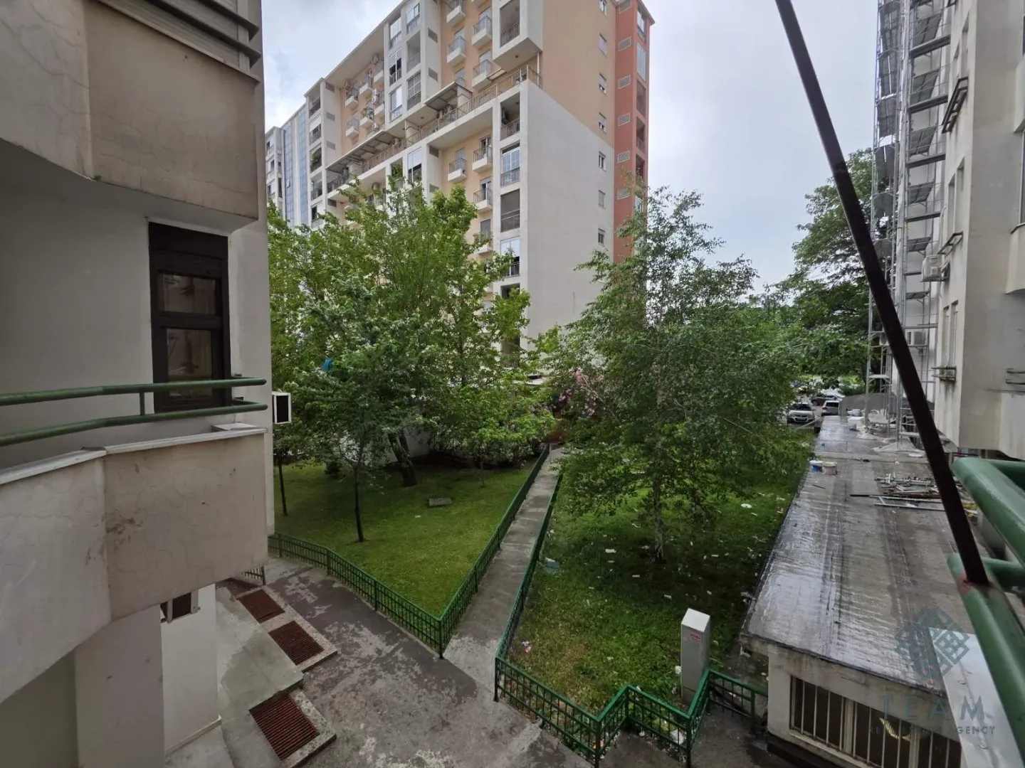 View from the apartment towards the courtyard and surrounding residential buildings.