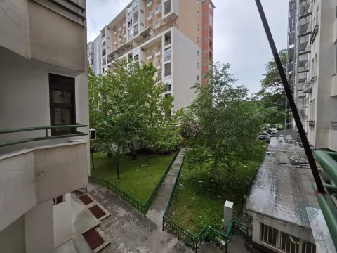 View from the apartment towards the courtyard and surrounding residential buildings. - image 5