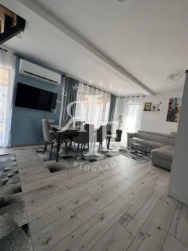 Spacious living room with a seating set and a dining area. - image 25