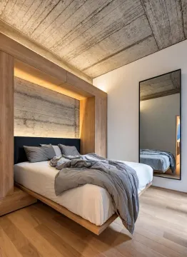 Modern bedroom with a double bed and wooden wall cladding. - image 11