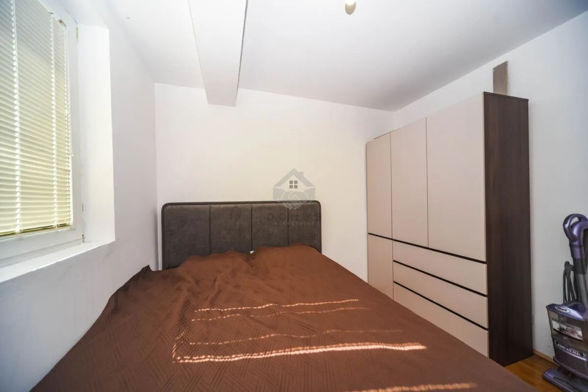 Bedroom with a double bed and a wardrobe.