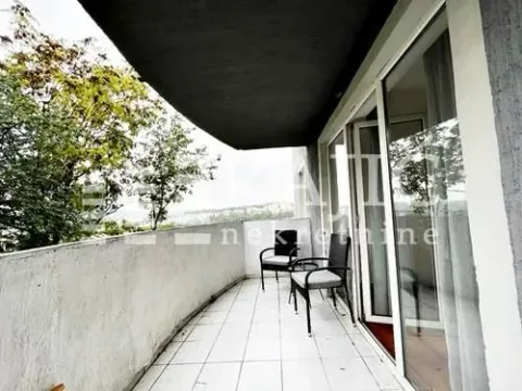 Covered terrace with chairs and a view of the surroundings. - image 14