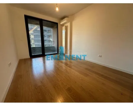 Empty room with wooden flooring and access to the terrace. - image 10