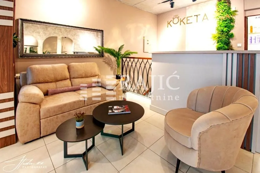 Modern living room interior with a sofa and an armchair.