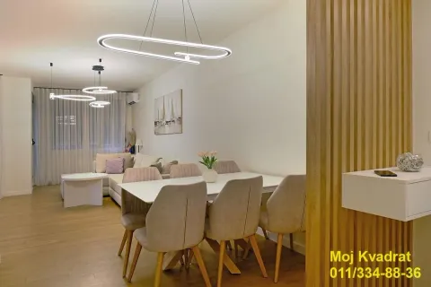 Living room with dining area and modern lighting. - image 5