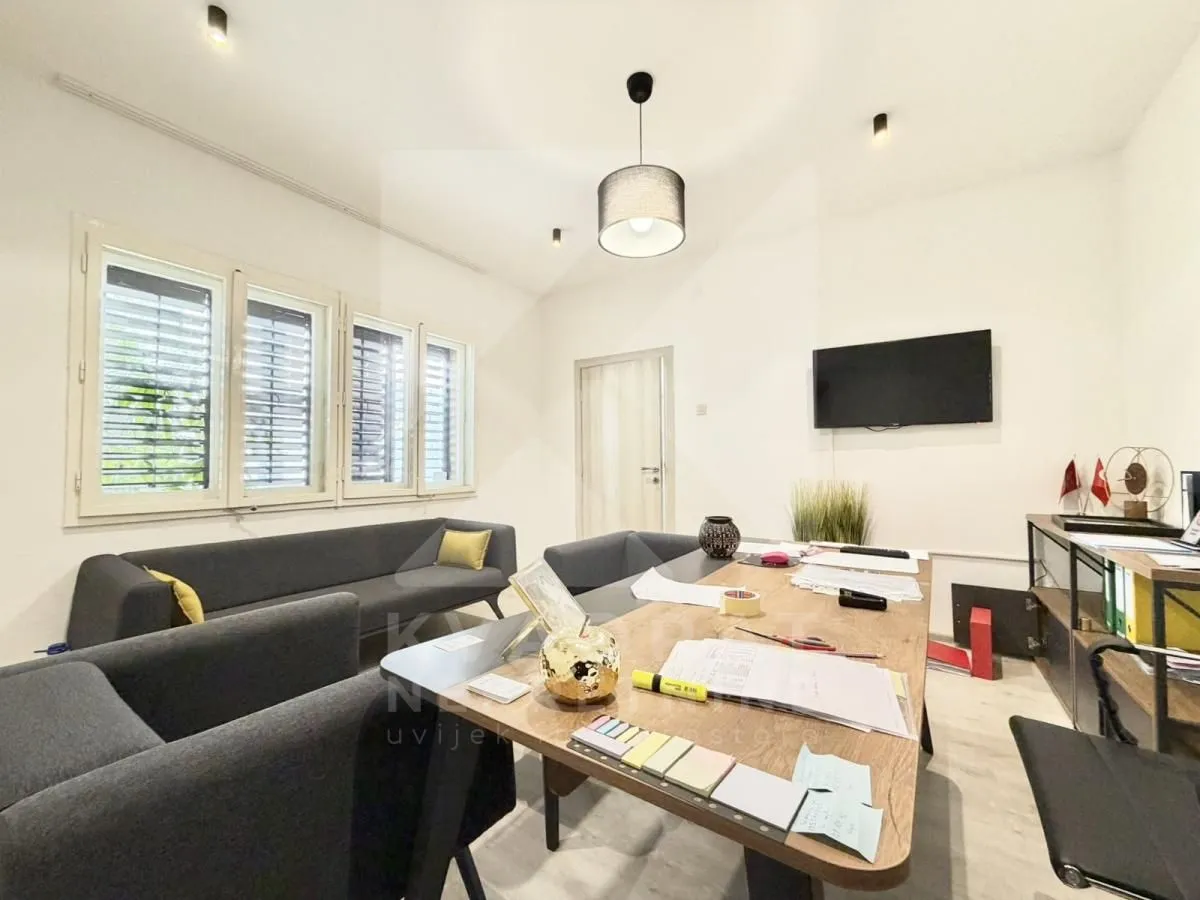 Spacious living room with a work desk and seating set.