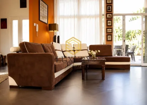 Spacious living room with a large sectional sofa and access to the terrace. - image 9
