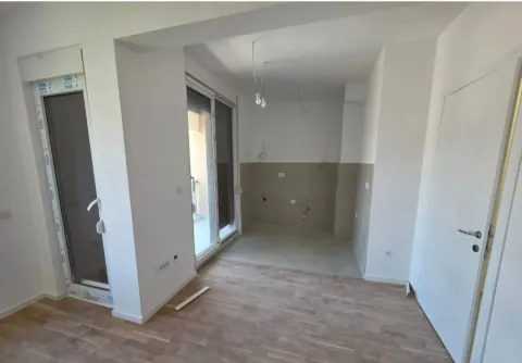 Empty kitchen with prepared installations in a new building. - image 2