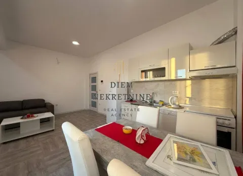 Living room with kitchen and dining area. - image 2