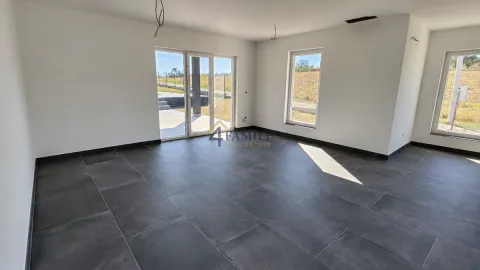Empty room under construction with ceramic tile flooring and large windows. - image 4