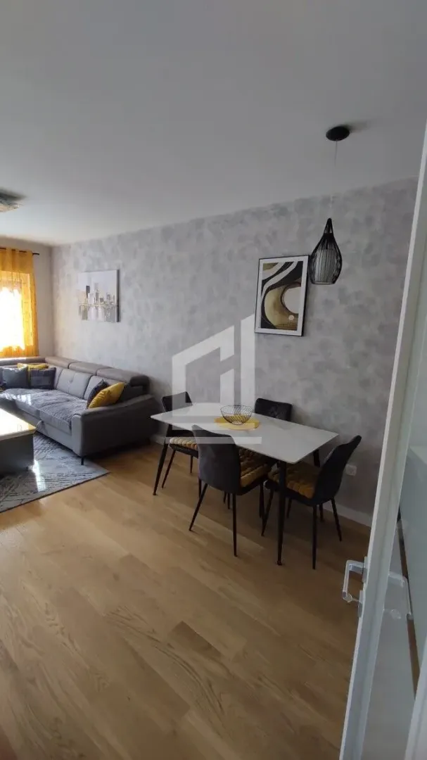 Living room with a dining area and seating set.