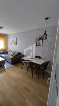 Living room with a dining area and seating set. - image 7