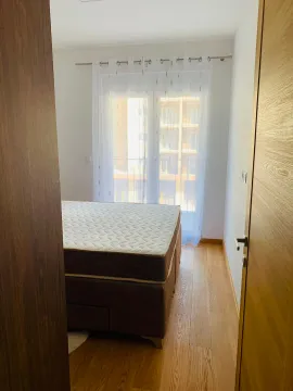 View of a bedroom with a bed and a window with curtains. - image 7