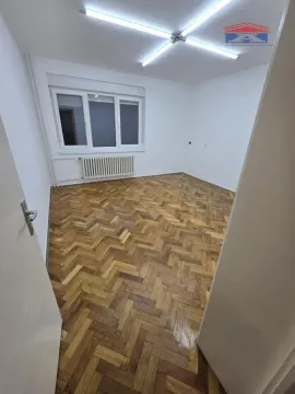 Empty room with parquet flooring and white walls. - image 2