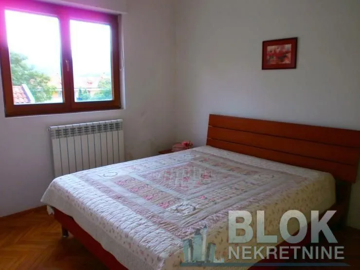 Bedroom with a double bed and a window.