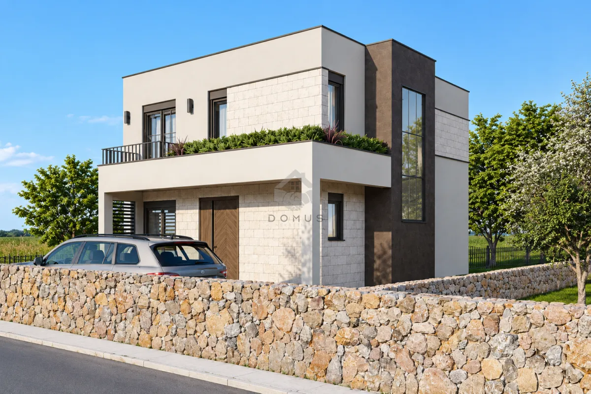 Exterior view of a modern two-story house with a yard and stone fence.