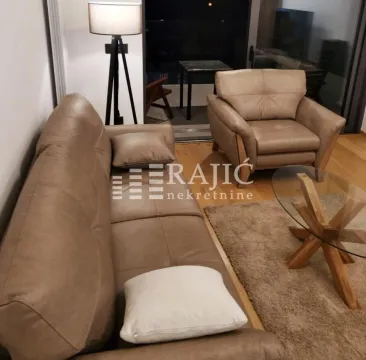 Living room with a sofa set and a lamp. - image 4
