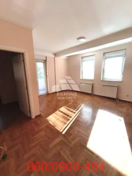 Empty room with parquet flooring and windows. - image 4