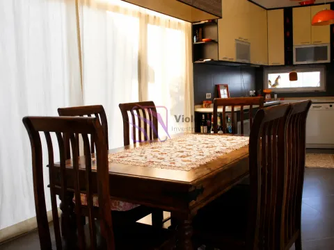 Dining table with chairs in the kitchen area. - image 7