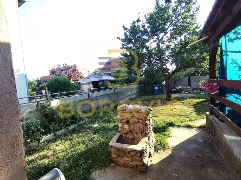 View of the landscaped yard with a lawn and trees. - image 9