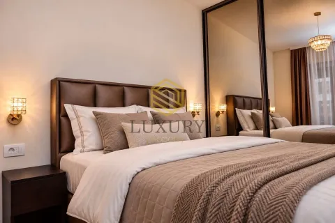 Modern bedroom with a double bed and a large mirror. - image 5