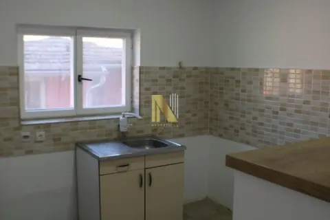 Small kitchen with a sink and a window. - image 7