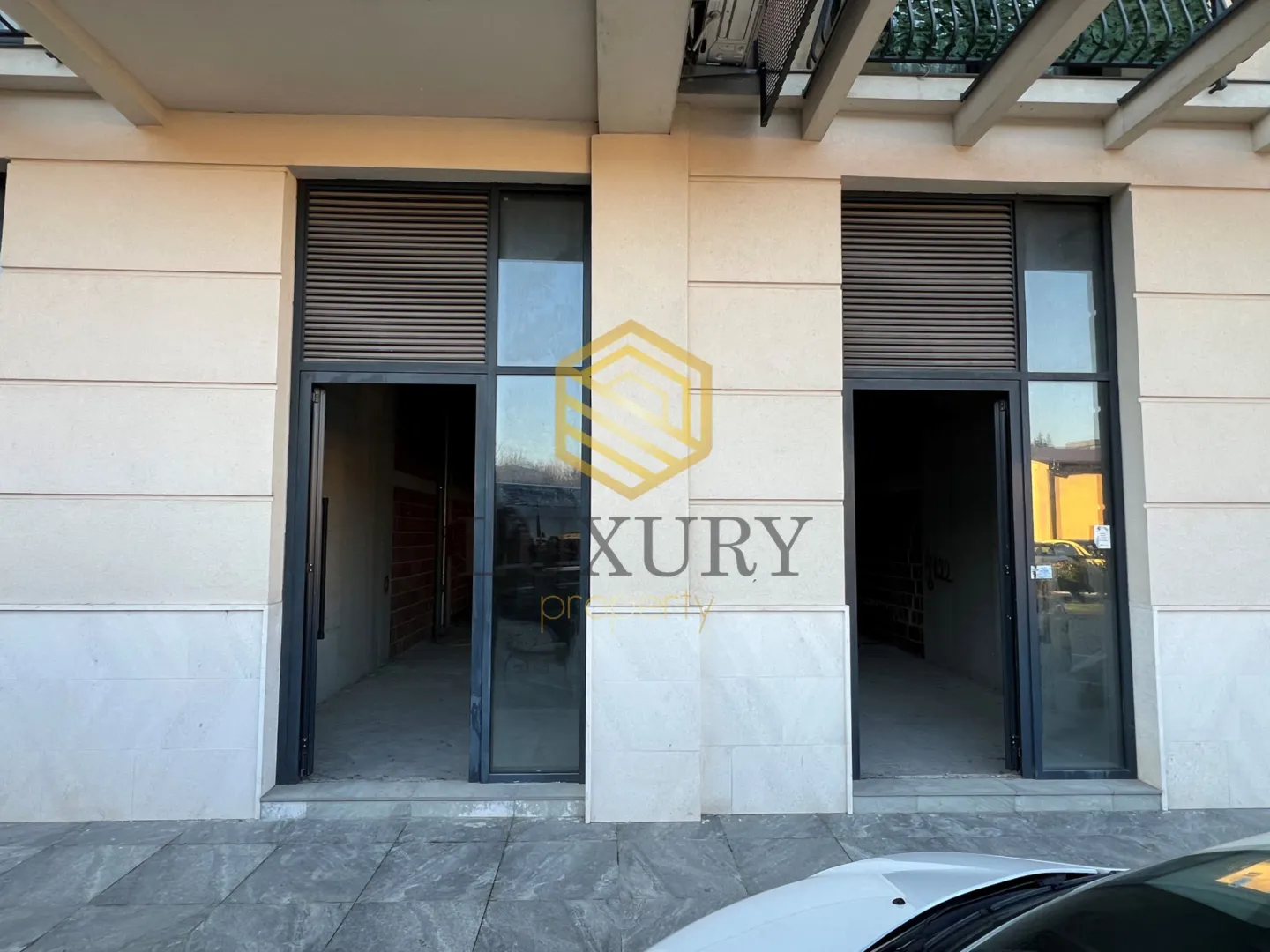 Exterior of commercial space with entrance doors.