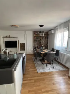 Living room with dining area and kitchen units. - image 5