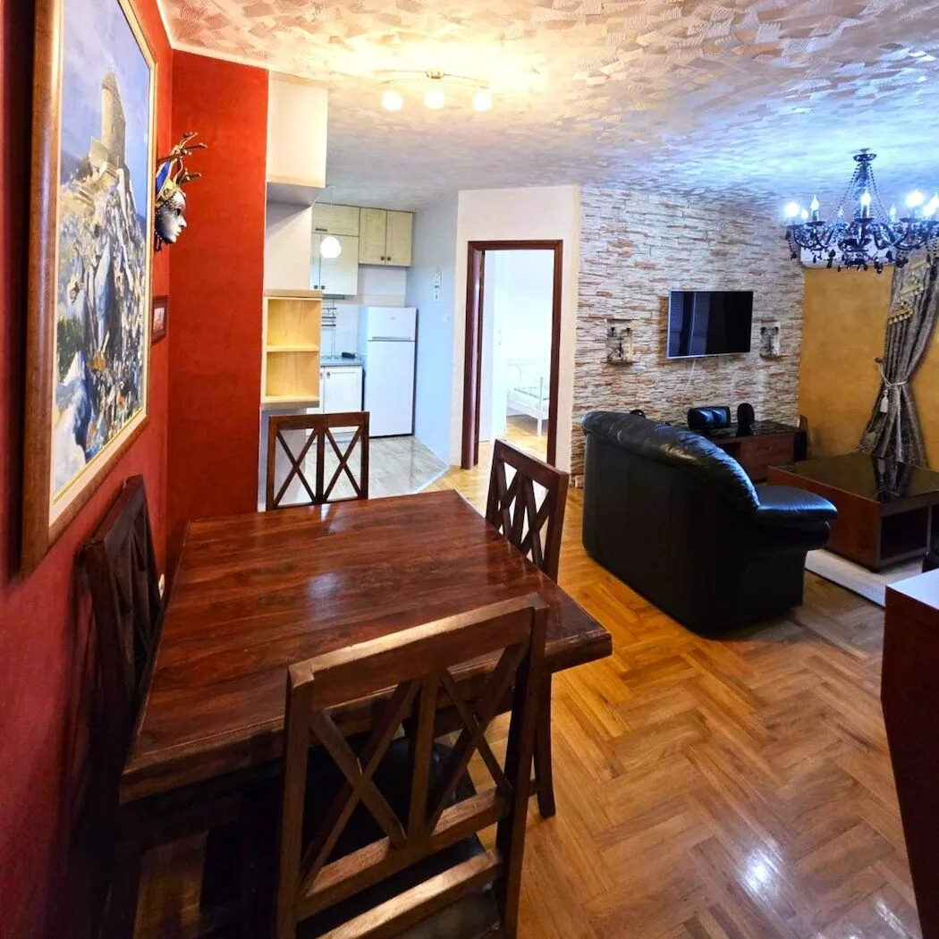 Spacious living room with a dining area and a view of the kitchen.