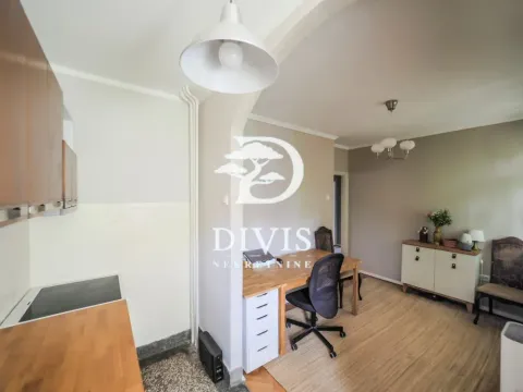 Living room with a dining table and kitchen units in the extension. - image 15