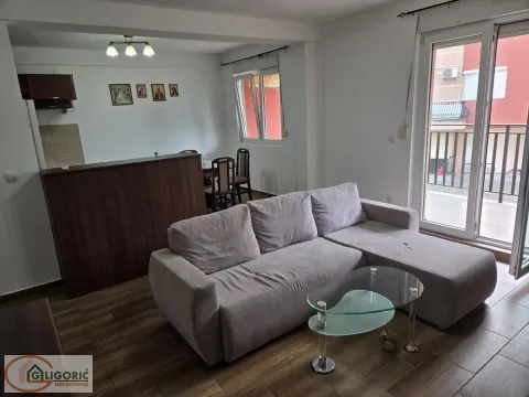 Living room with a sofa and access to the terrace. - image 2