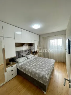 Furnished bedroom with a double bed, fitted wardrobes, and a window. - image 6