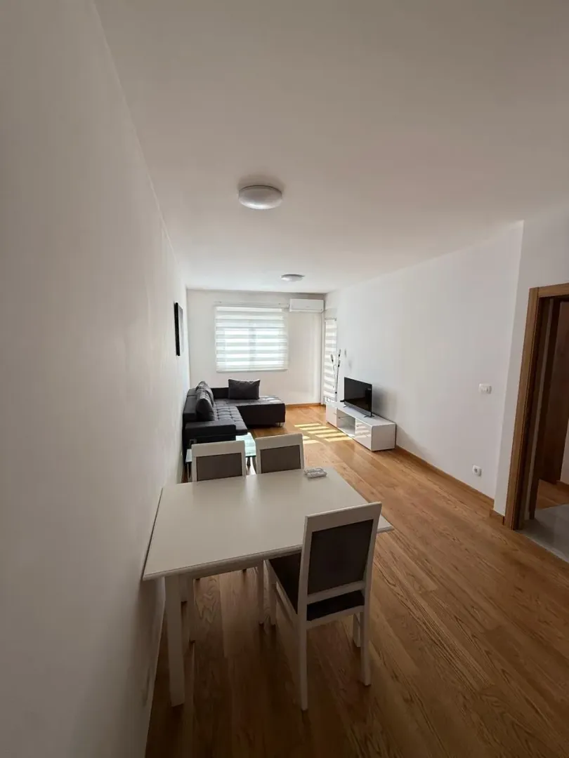 Living room with dining area and sofa.