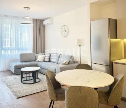Living room with dining area and kitchen. - image 18