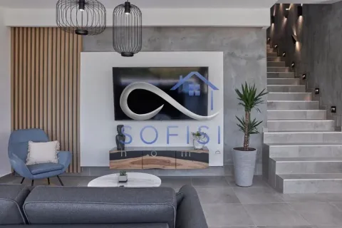 Modern living room with television, sofa and stairs in the background. - image 3