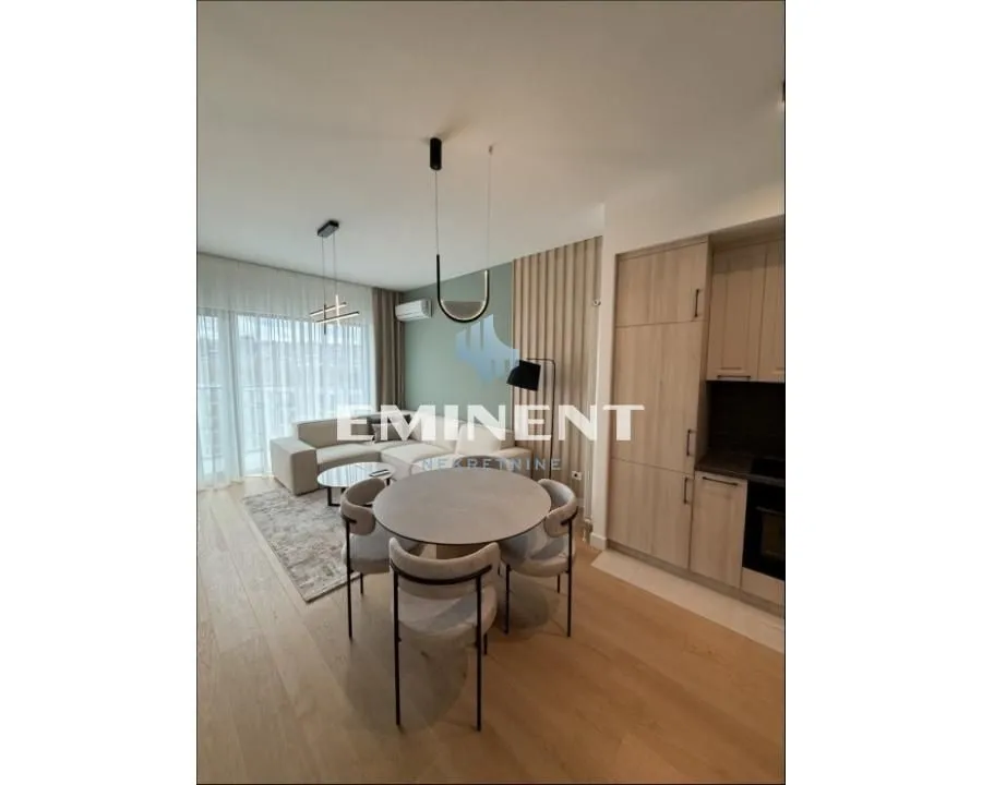 Open-plan living room with dining area and kitchen.