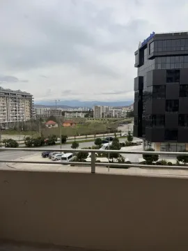View from the terrace towards the city and surrounding buildings. - image 11